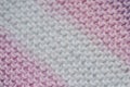 Fragment of handmade seamless knitted patterns in mixed pastel colors