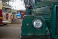 A fragment of the headlight of a green retro truck Royalty Free Stock Photo