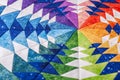 Fragment of hexagon patchwork block like kaleidoscope, detail of quilt, colors of rainbow Royalty Free Stock Photo