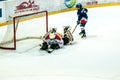 A fragment of the hockey penalty shot performed by the young hockey player