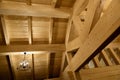 Fragment of a house made of wooden beams. Roof view with chandelier. Construction of frame houses from environmentally friendly Royalty Free Stock Photo