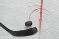 Fragment of ice hockey rink with a stick and puck Royalty Free Stock Photo