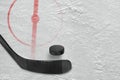 Fragment of ice hockey rink with a stick and puck Royalty Free Stock Photo