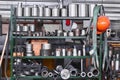 Fragment of industrial interior with a storage of metal products and tools in the workshop Royalty Free Stock Photo