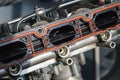 Fragment of the intake manifold from a car engine Royalty Free Stock Photo