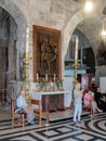 Fragment of the interior of the Church of the Holy Sepulchre in Jerusalem, Israel. The guide tells visitors about the temple. Royalty Free Stock Photo