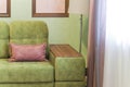 Fragment of the interior with a green sofa and picture cards Royalty Free Stock Photo