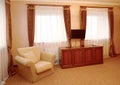 Fragment of an interior of the hotel room in brown tones. Modern classics