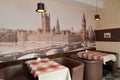 Fragment of an interior of modern cafe with the photo of the Westminster palace on a wall