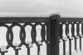 Fragment of the iron fence of the winter quay Royalty Free Stock Photo