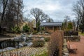 Fragment of The Japanese Garden with tea house in the Botanical garden of Peter the Great at snowless winter day. Saint-Petersburg