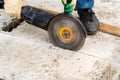 Close up worker cuts concrete with circular saw Royalty Free Stock Photo