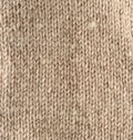 Fragment of knitted fabric from light brown wool of a sheep Royalty Free Stock Photo