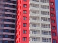 Fragment of the lined facade of a red-black new residential building Royalty Free Stock Photo