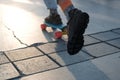 Fragment of a longboard and legs close-up.