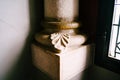 Fragment of the lower part of the column near the window Royalty Free Stock Photo