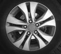 Fragment of luxury car with wheel on steel disc, closeup photo Royalty Free Stock Photo