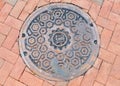 Fragment manhole cover in the city Royalty Free Stock Photo