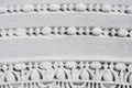 Fragment of a marble column with antique stone carvings. Stone column of the ruins of an ancient city Royalty Free Stock Photo