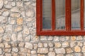 Fragment masonry stone wall with grunge wood window