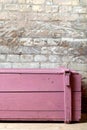 A fragment of a massive pink wooden chest in vintage style