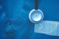 Fragment of medical work wear with protective mask and stethoscope Royalty Free Stock Photo