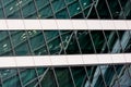 Fragment of modern building. Close-up. A beautiful combination of metal and glass.