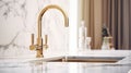 Fragment of modern classic luxury kitchen. White marble backsplash and countertop with built-in sink, curved gold faucet Royalty Free Stock Photo