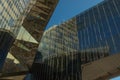 Fragment of the modern glass facade of the building and the reflection