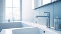 Fragment of a modern luxury bathroom with white tile walls. White wall-hung cabinet with sink, chrome faucet. Window in Royalty Free Stock Photo