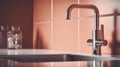 Fragment of modern minimalist kitchen. Gray stone countertop with built-in sink and metallic faucet. Terracotta tile