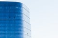 A fragment of a modern office building with glass facades on a sunny day Royalty Free Stock Photo