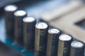Fragment of the motherboard with electrolytic capacitors. Capacitive Assembly. Electronic component capacitor on the blue printed Royalty Free Stock Photo