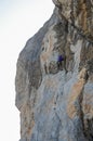 Rock climber climbs the cliff, close-up view