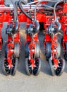 A fragment of a multi-row modern red seeder used in the agricultural sector