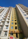 A fragment of a multi-storey building under construction insulated with plates of heat-insulating material