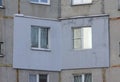 A fragment of a multi-storey concrete panel residential building with an externally applied external insulation on the Royalty Free Stock Photo