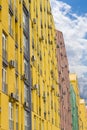 Fragment of a multicolored facade of the modern apartment complex