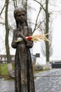 Sculpture of hungry young girl with ears of wheat in their hands. Kiev, Ukraine Royalty Free Stock Photo