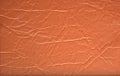 Fragment of a natural rough leather, bright brown Royalty Free Stock Photo