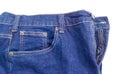 Fragment of the new classical blue jeans on white background Royalty Free Stock Photo