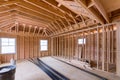 Fragment of a new home under construction wood framing beams