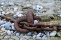 Fragment of old anchor chain on stone background. Marine theme and style. Royalty Free Stock Photo