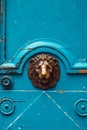 The fragment of an old blue medieval door decorated lion Royalty Free Stock Photo