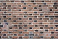 Fragment of old brick wall with multicolored bricks and tones, background Royalty Free Stock Photo