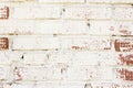 Fragment of old brick wall with peeling plaster, brick texture Royalty Free Stock Photo