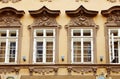 Fragment of old facade at a historic building with windows Royalty Free Stock Photo