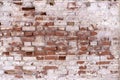 A fragment of an old flaked unrestored brick wall of an orthodoxal church in a small Russian town Royalty Free Stock Photo