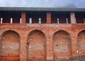 Fragment of the old fortress wall. Kolomna Kremlin. Old brickwork. Red brick wall texture