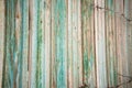 Fragment old green wooden fence. Wooden texture. Texture, background.Old wood painted surface